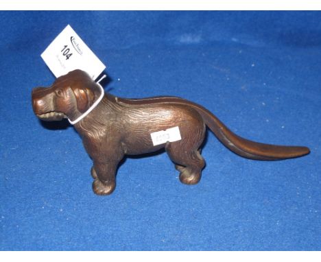 Cast iron nut cracker in the form of a standing dog. 