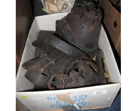 Collection of vintage shire horse harness to include leather shoe covers, head collar and girth. 