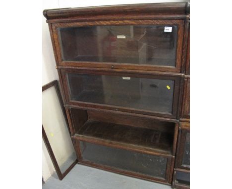 Early 20th century oak four section Globe-Wernicke book case with metal banding. (Marked the Globe-Wernicke Co. Limited) COND