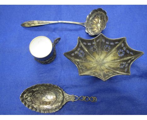 Two cased drawing instrument sets, white metal ladle, strainer spoon, white metal pierced basket, and porcelain coffee cup in