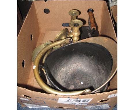 Small box of assorted metal ware to include brass candle stick, chamber stick, flat iron and a brass and metal helmet shaped 