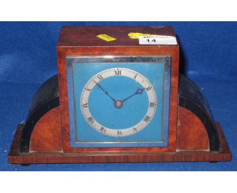 Art Deco design walnut mantle clock with French brass drum movement. 