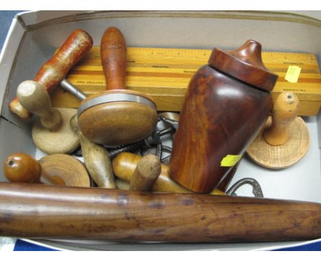 Box of assorted treen items to include bobbin turns, assorted barrel top cork screws, cast metal bottle openers marked 'Macke