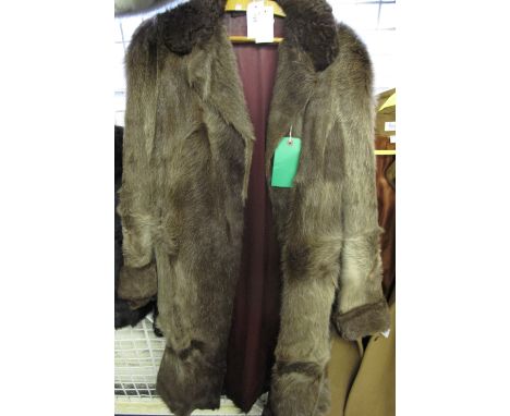 Vintage 1950s ladies mink fur swing coat, a-line with inner ties. Insignia red lining. Self lined collar, two pockets, medium