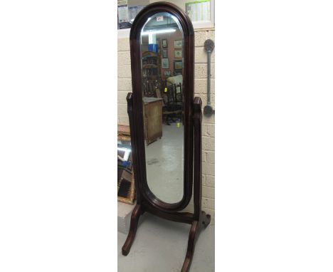 20th century mahogany oval bevel plate cheval type mirror. 