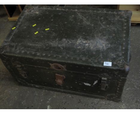 Metal bound travelling trunk with leather handles.
