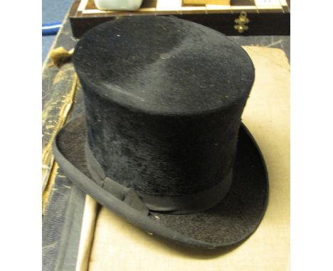 Vintage black top hat by Christys' London.  CONDITION REPORT; Hat is rather grubby, silk ripped to the interior, wear to unde