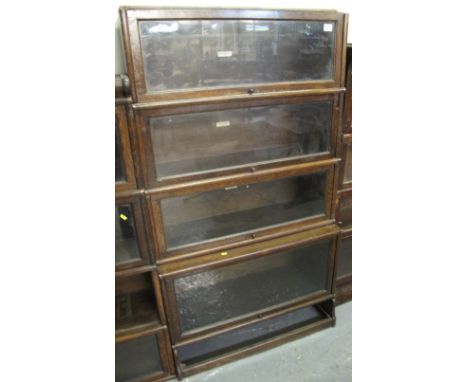 Early 20th century oak four section Globe-Wernicke book case with metal banding. (Marked the Globe-Wernicke Co. Limited)
 CON