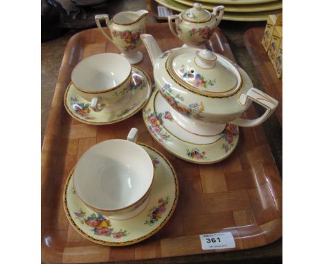 Crown Ducal china tea for two set overall decorated on a white ground with geometric banding and floral decoration. 