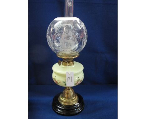Early 20th century brass double burner oil lamp with painted opaline glass reservoir on a repousse brass pedestal with circul