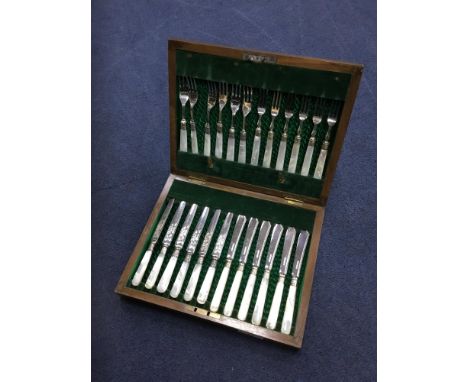 SET OF MOTHER OF PEARL HANDLED FRUIT KNIVES AND FORKS, in a fitted case, along with an oak canteen of cutlery (2)