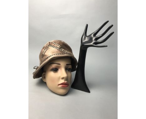 FEMALE MANNEQUIN HEAD, along with a ring stand in the form of a hand