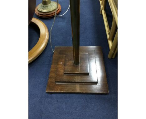 BRASS STANDARD LAMP, with stepped oak base and a mahogany framed oval wall mirror