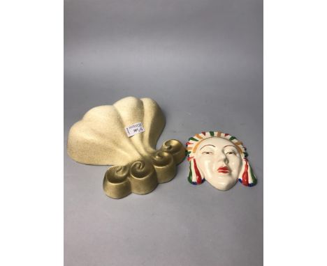 ART DECO STYLE FACE MASK, in the manner of Clarice Cliff; along with two Art Deco style wall pockets and a wall mask of a fem