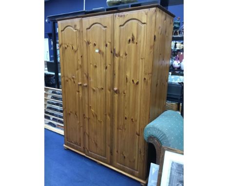 MODERN PINE WARDROBE, along with a chest of drawers, pair of bedside cabinets, a headboard and a cheval mirror