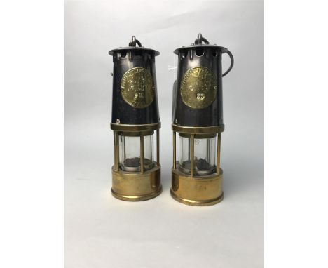 ECCLES PROTECTOR LAMP NO. 23, along with another (number rubbed, possibly 79)