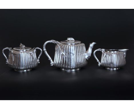 A FINE JAPANESE SILVER THREE PIECE TEA SERVICE, CIRCA 1890-1910, comprising teapot, cream jug and sucrier, the simulated bamb