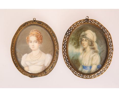 TWO PORTRAIT MINIATURES: the first oval, of a lady in Regency costume with turban and blue sash, within a pierced gilt-metal 
