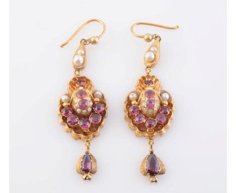 A PAIR OF GILT METAL, PEARL AND GARNET EARRINGS, the moulded metal shell design mount set throughout with seven graduating ro