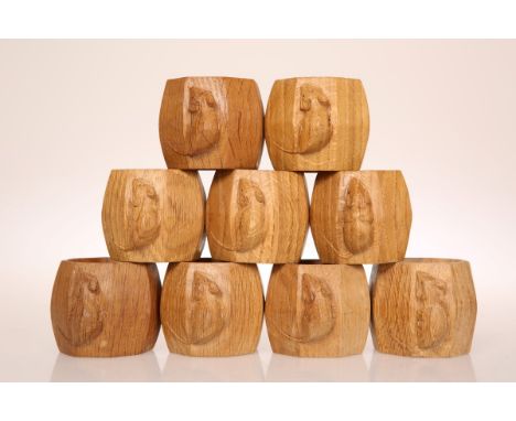 ROBERT THOMPSON OF KILBURNA GROUP OF NINE MOUSEMAN NAPKIN RINGS, of octagonal section, each with carved mouse signature. 5cm