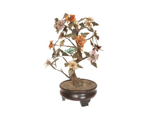 A CHINESE SPECIMEN HARDSTONE TREE JARDINIERE, possibly 19th century, realistically modelled, the flowers of jade, agate, turq