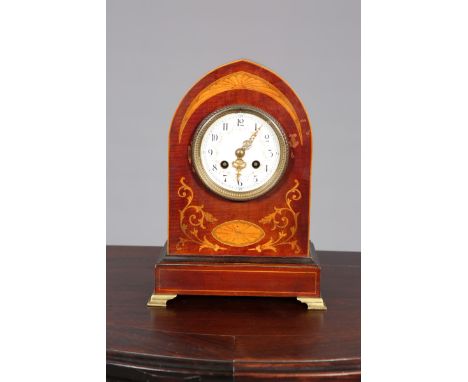 AN EDWARDIAN INLAID MAHOGANY MANTEL CLOCK, the circular dial with Arabic numerals and floral swags, Marti two-train movement,