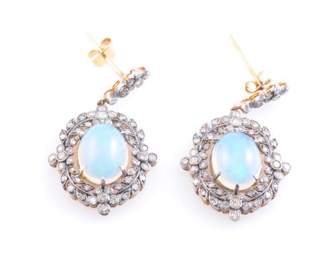 A PAIR OF OPAL AND DIAMOND EARRINGS, oval cabochon cut opal claw set within a floral and foliage surround set throughout with