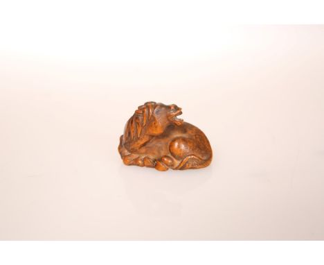 A JAPANESE WOOD NETSUKE OF A RECUMBENT HORSE, 19th Century, signed. 40mm