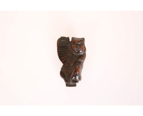 A JAPANESE BOXWOOD FIGURAL NETSUKE, carved in robes and holding a scroll. 51mm