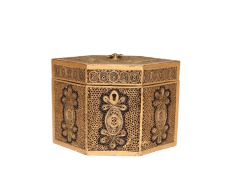 A GEORGE III ROLLED PAPERWORK TEA CADDY, LATE 18th CENTURY, of hexagonal form, the panels with characteristic decoration of g