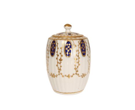 A CAUGHLEY TEA CADDY, c. 1780, of barrel form, the ribbed body painted in blue and gilt with stylised swags, the domed cover 