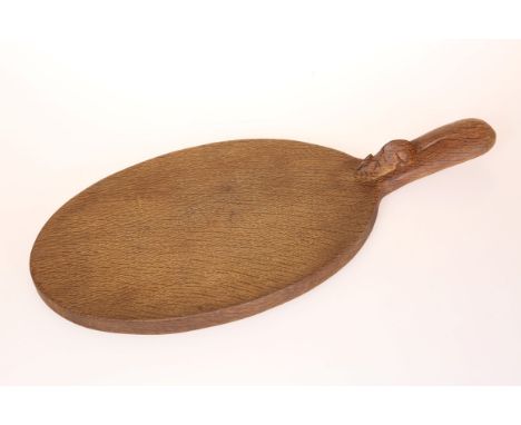 ROBERT THOMPSON OF KILBURNA MOUSEMAN OAK CHEESEBOARD, of characteristic form oval form with carved mouse signature to the han