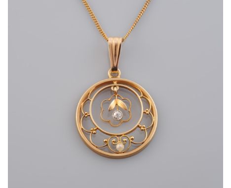 A DIAMOND SET PENDANT, the circular mount with delicate cut out floral and swag detailing set with a single seed pearl highli