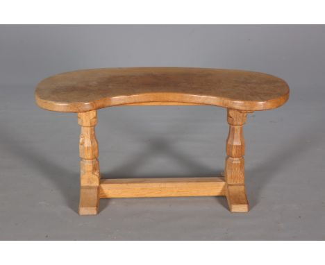 ROBERT THOMPSON OF KILBURNA MOUSEMAN OAK KIDNEY SHAPED COFFEE TABLE, the burr top above a trestle base with carved mouse sign