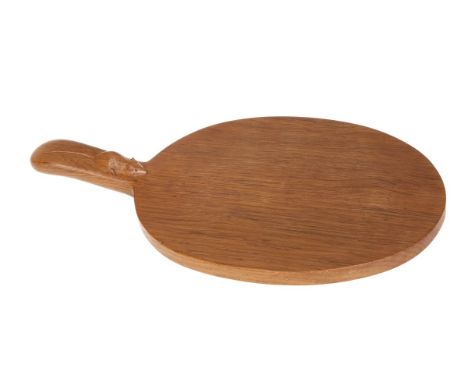 ROBERT THOMPSON OF KILBURNA MOUSEMAN OAK CHEESEBOARD, with good grain, of characteristic form, the handle with carved mouse s