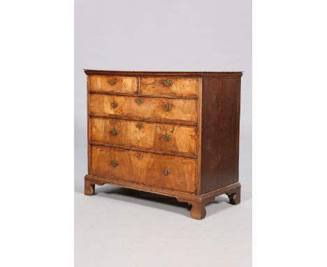 A WALNUT AND OAK CHEST OF DRAWERS, EARLY 18TH CENTURY AND LATER, the oak top above two short over three long drawers, raised 