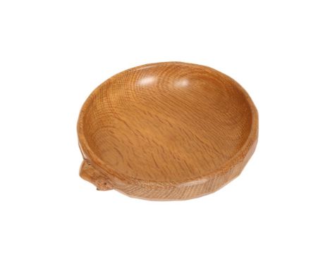 ROBERT THOMPSON OF KILBURNA MOUSEMAN OAK NUT DISH, of circular form, with facet carved exterior and carved mouse signature. 1