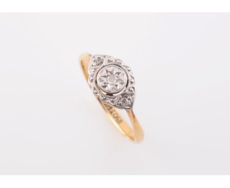 A DIAMOND SET RING, circa 1900, the marquise shaped mount with scalloped edge detailing and two diamond set highlights, set t