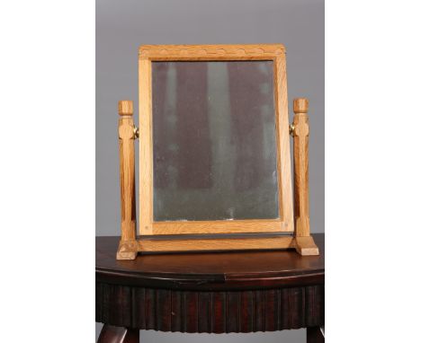 ROBERT THOMPSON OF KILBURNA MOUSEMAN OAK DRESSING TABLE MIRROR, the rectangular mirror with moulded crest, swinging between f