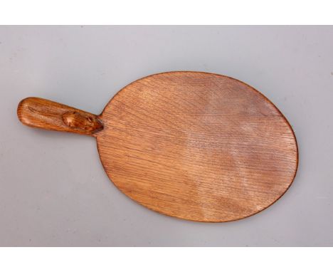 ROBERT THOMPSON OF KILBURNA MOUSEMAN OAK CHEESEBOARD, of characteristic oval form with carved mouse signature to the handle, 