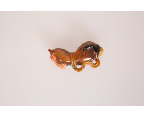 A JAPANESE PORCELAIN GOURD NETSUKE, signed with underglaze blue characters; 54mm; together with A CLOISONNE ENAMEL DOUBLE GOU