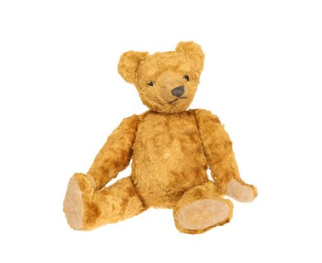 A PLUSH TEDDY BEAR, with hump back, no button. 33cm