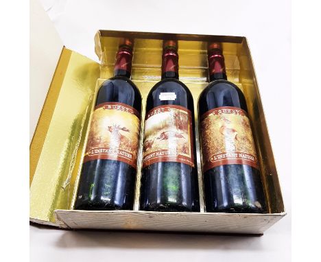 3 BOTTLES OF RED WINE IN A BOOK