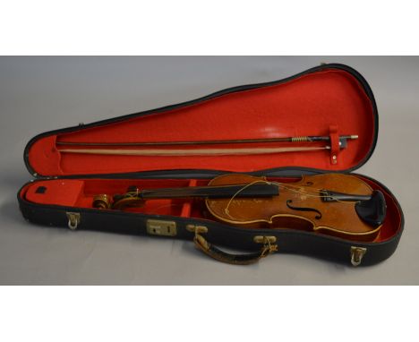 A cased vintage violin and bow