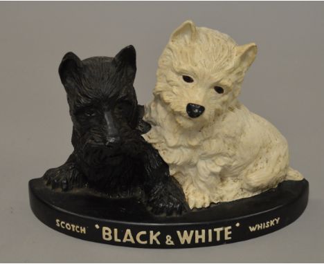 A 'Black & White' Scotch Whiskey resin advertising figure.