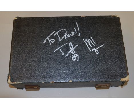 A cased clarinet signed by Guns N Roses and Velvet Revolver bassist Duff McKagen, with digital photograph of Duff signing the