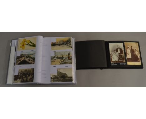 Two postcard albums containing vintage postcards and photographs.