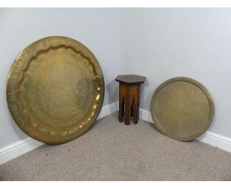 An eastern brass circular Benares Tray with another of a smaller size, Diameter is 88cm and 56cm, together with a small hexag