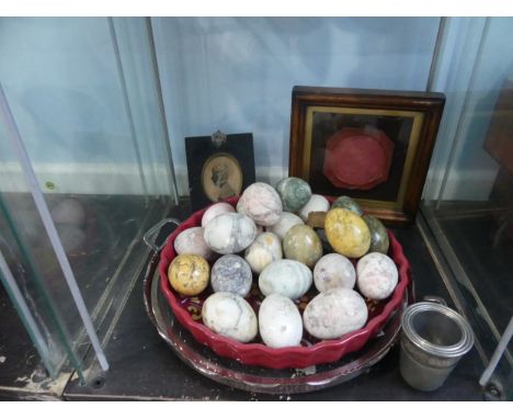 A collection of Stone Eggs, approx. 24, mostly unpolished, together with a graduated set of four 'Just a Thimble Full' spirit