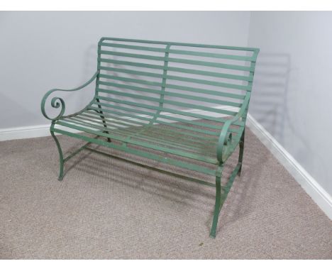 Garden Furniture; a vintage green-painted 'Park' Bench style cast iron Garden Seat, with curved back and scroll arm rests, W 